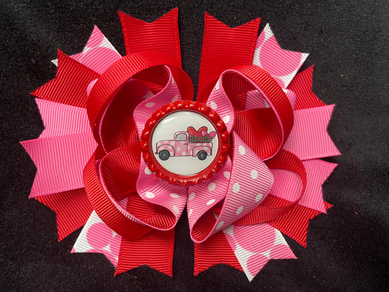 LAYERED MULTI COLOR AND VARIOUS STYLE RIBBONS BOW WITH OLD TRUCKS AND HEARTS BOTTLE CAP CENTER (Roughly 5” in length) - Lil Monkey Boutique