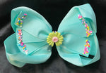 EXTRA LARGE FLORAL CONCHO SOLID COLOR BOW WITH SPRINKLES (ROUGHLY 7”) - Lil Monkey Boutique