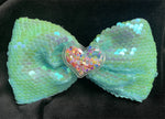 SEQUIN SOLID BOWS WITH CONFETTI FILLED HEART CENTER (FOAM LIKE MATERIAL) ROUGHLY 5 1/2" - Lil Monkey Boutique
