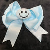 LARGE STUFFED SMILEY FACE BOWS WITH TAILS (roughly 6in) - Lil Monkey Boutique